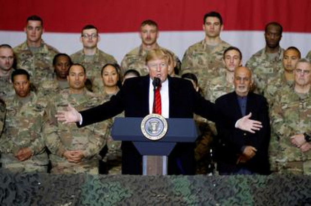 Exclusive: Pentagon presses ahead with Afghanistan troop drawdown despite law barring it